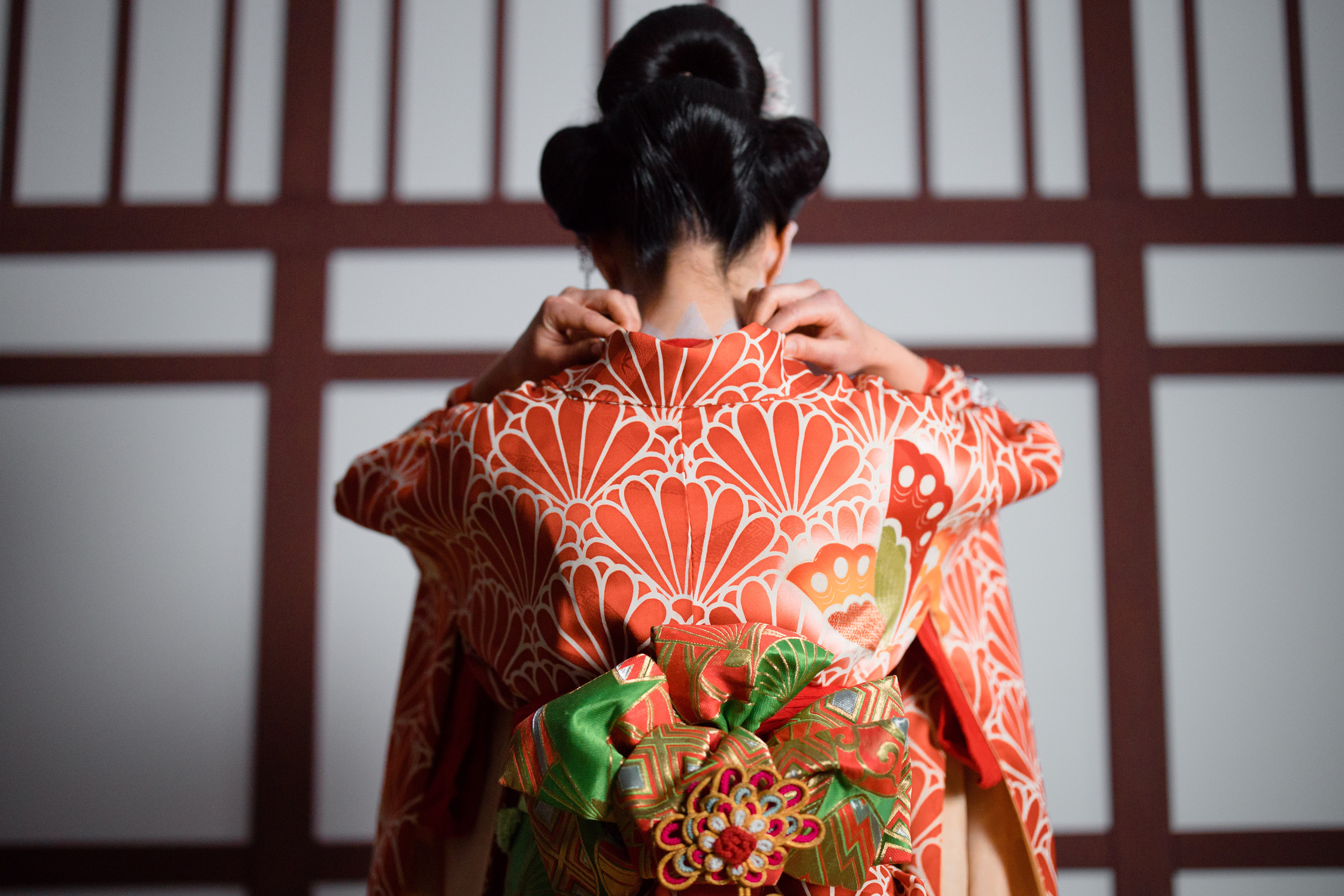 Back View of a Woman in Red and White Floral Kimono